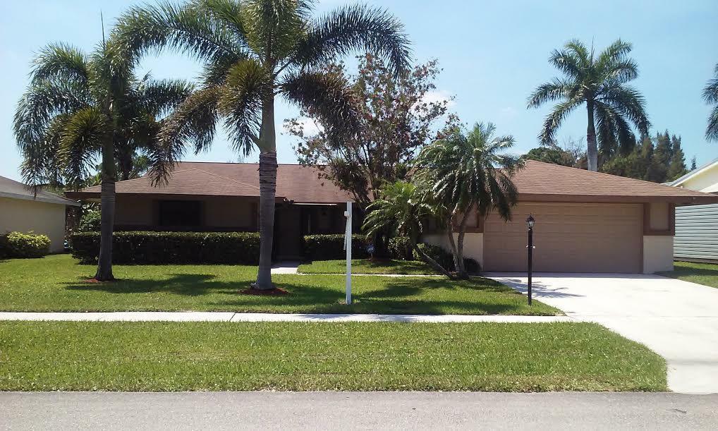Property Photo: 8497 Mildred Drive W FL 33472