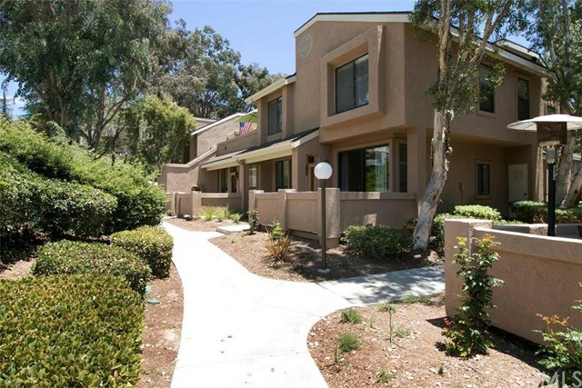 Property Photo:  155 N Singingwood Street 54  CA 92869 