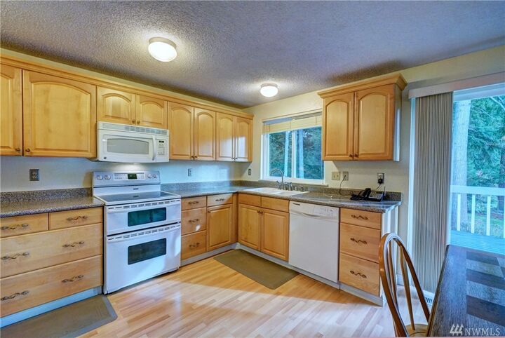 Property Photo:  19265 NE Crestwood Ct  WA 98370 