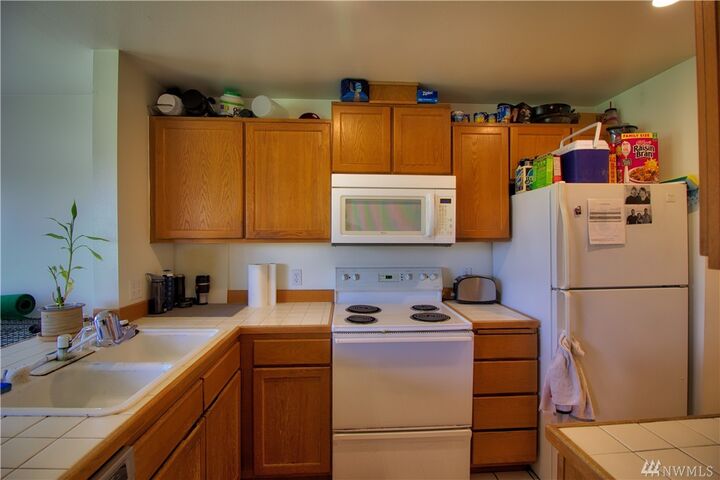 Property Photo:  9735 272nd Place NW 520  WA 98292 