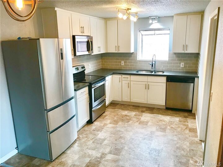 Property Photo:  1616 Violet Meadows St S  WA 98444 