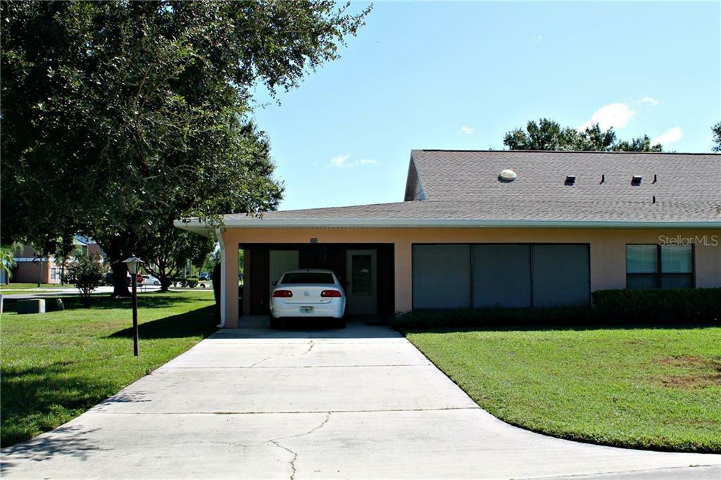 Property Photo:  302 Genesis Pointe Drive 11-2  FL 33859 