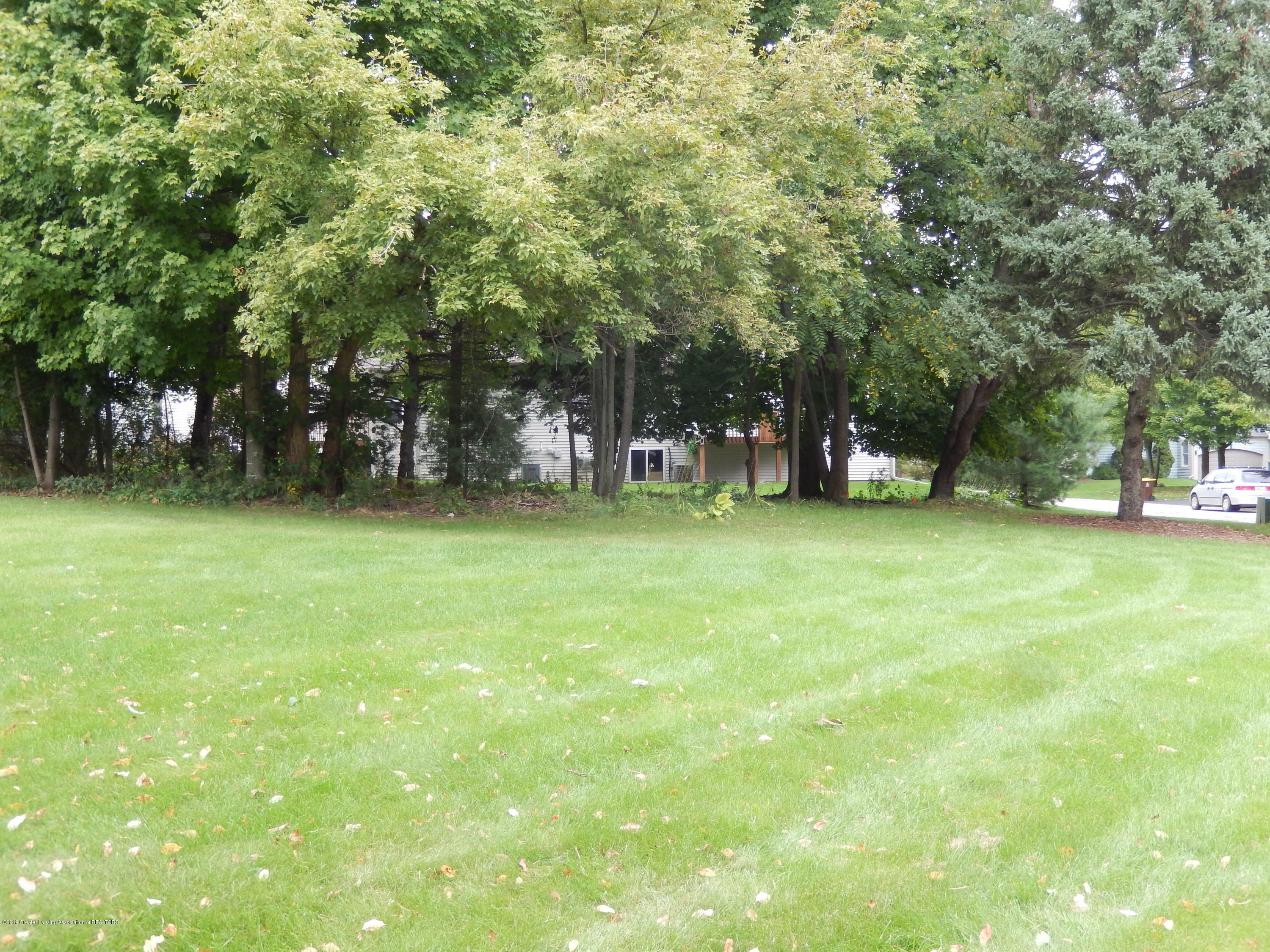 Property Photo:  902 Hardwood Trail  MI 48875 