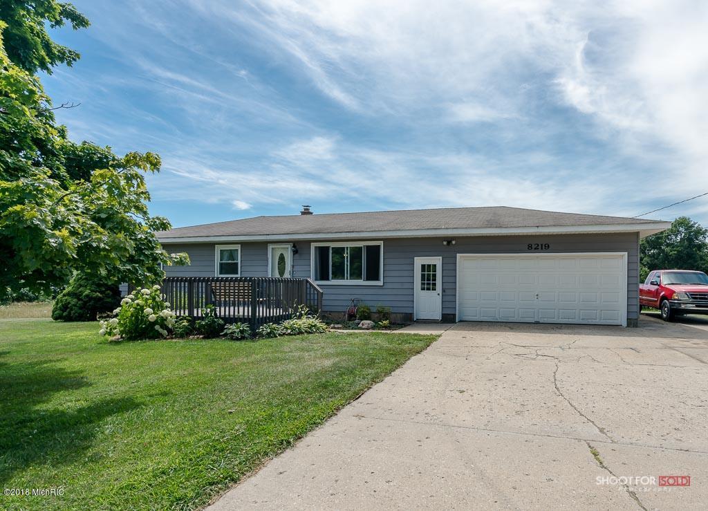 Property Photo: 8219 Alpine Avenue NW MI 49345
