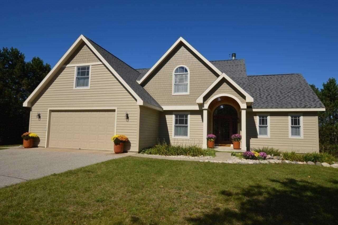 Property Photo:  212 Meadow Wood  MI 49740 