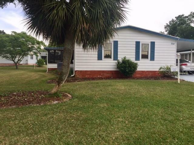 Property Photo: 704 Tangerine Drive FL 32159