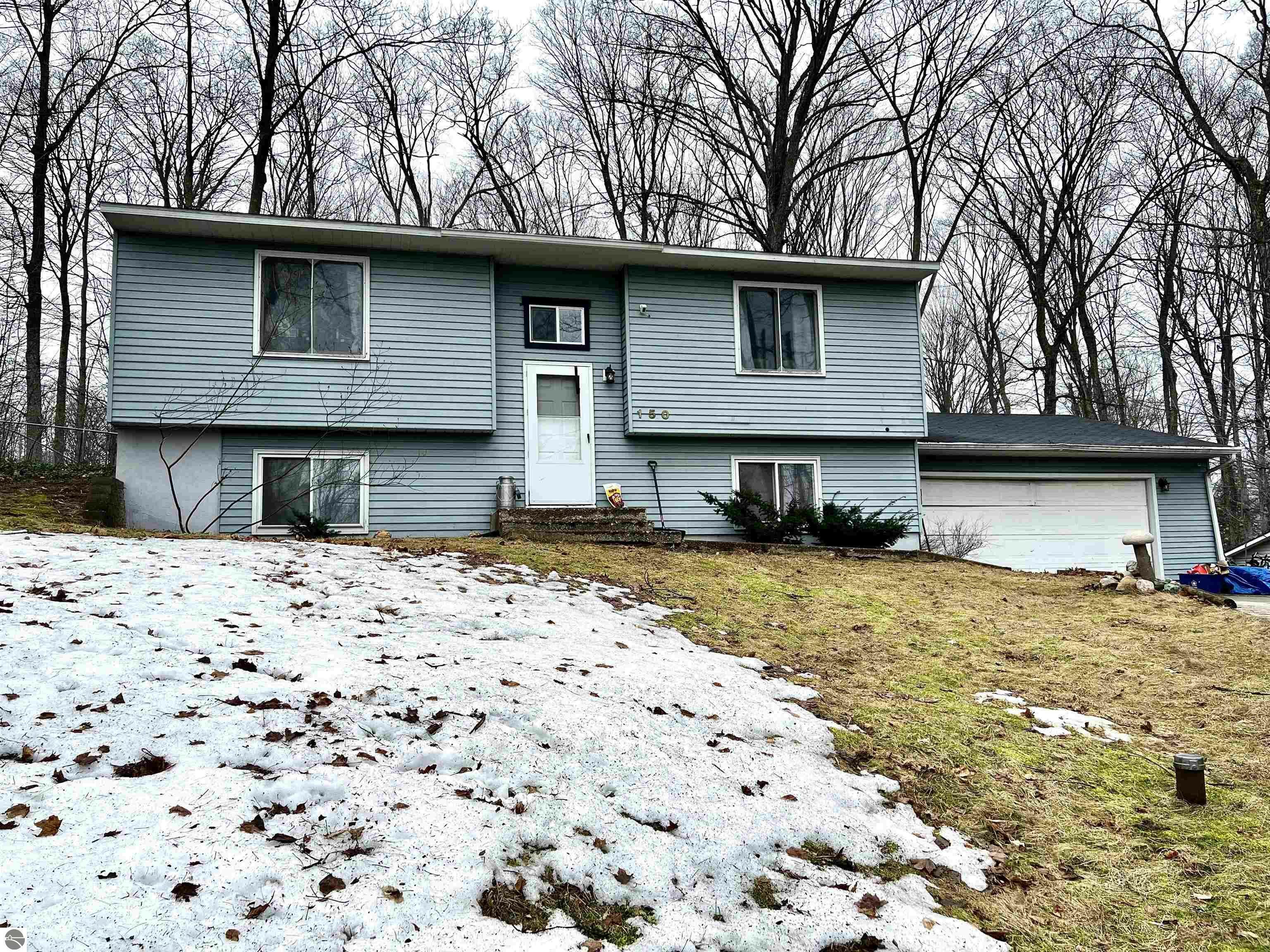 Property Photo:  150 S Four Mile Road  MI 49696 