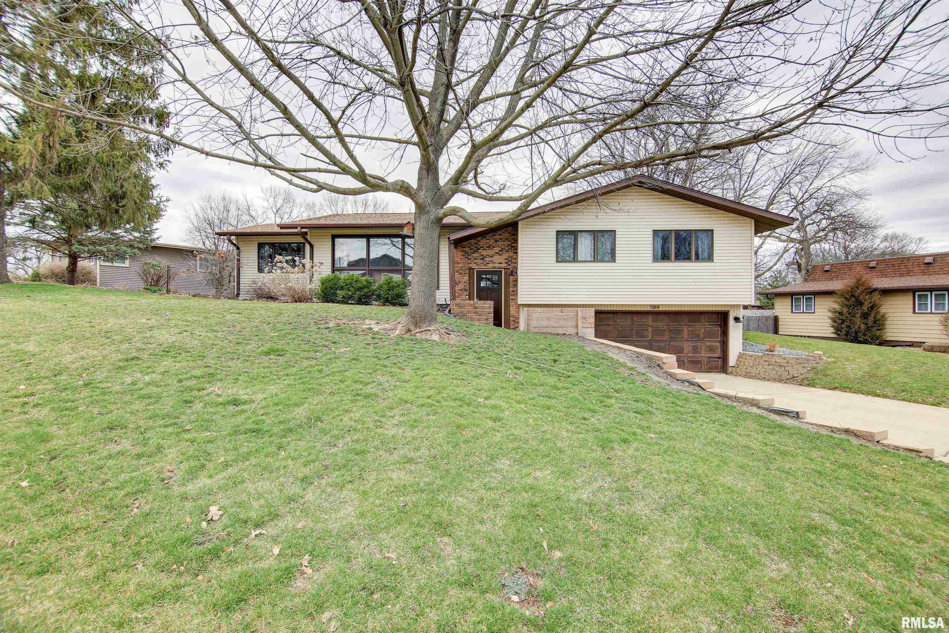 Property Photo:  584 Woodland Drive  IA 52732 