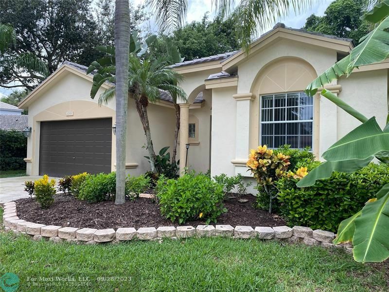 Property Photo:  6001 NW Swans Way  FL 33073 