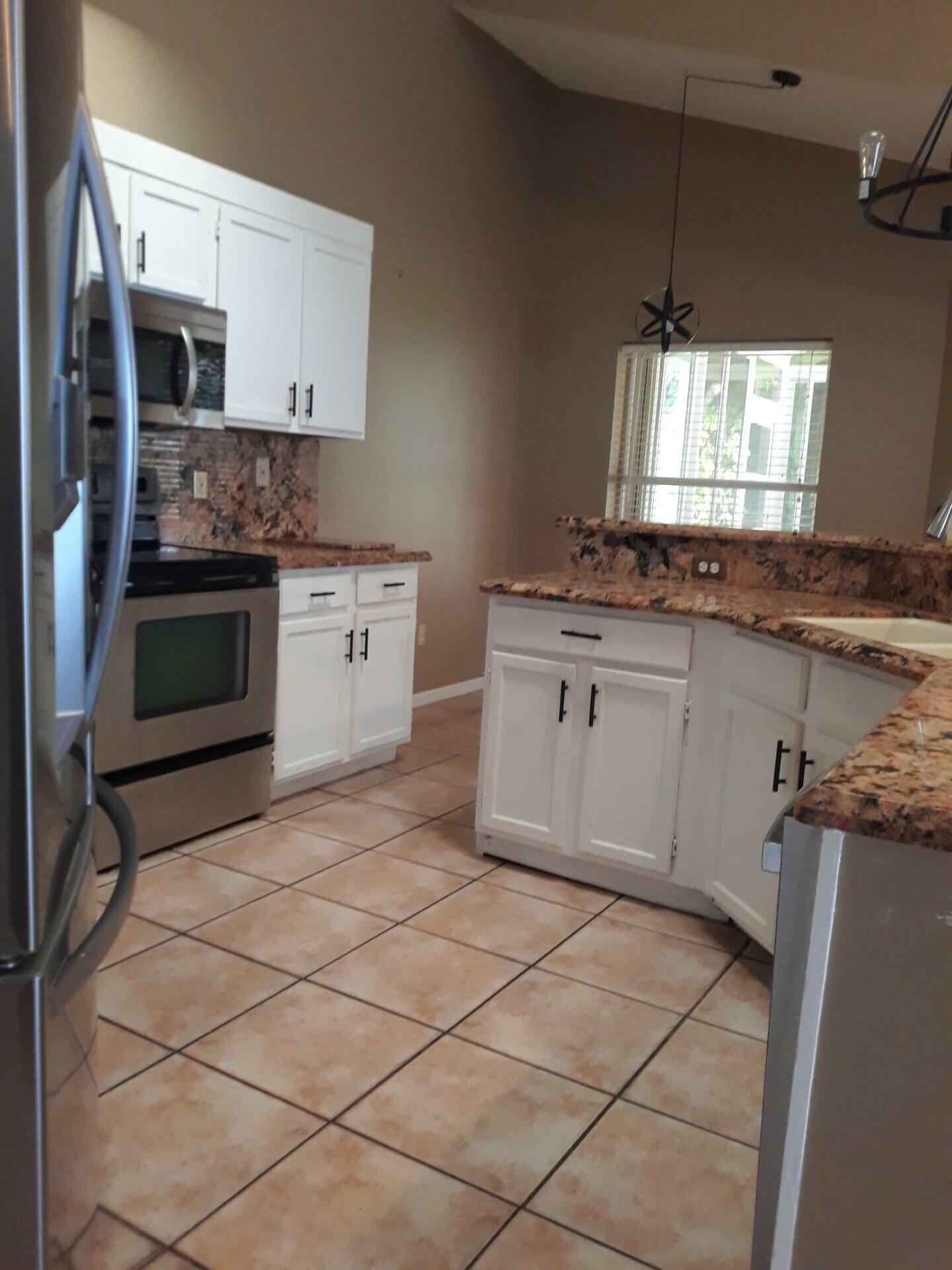 Property Photo:  5080 Foxhall Drive S  FL 33417 