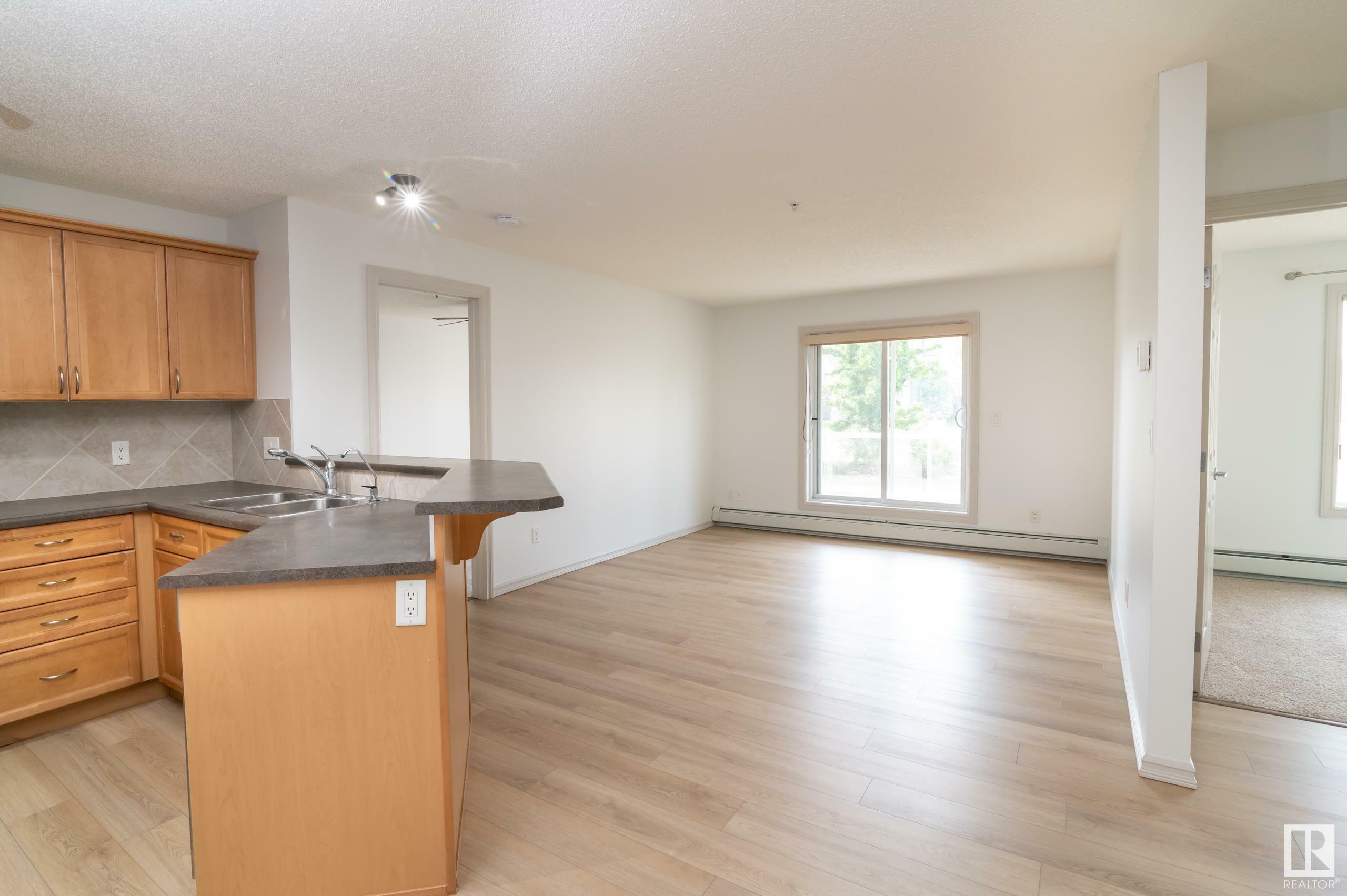 Property Photo:  13830 150 Avenue NW 118  AB T6A 1X2 