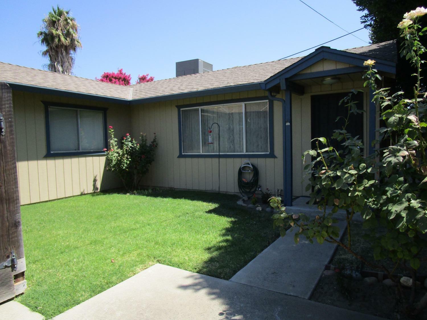 Property Photo:  422 S Locust Avenue  CA 95366 