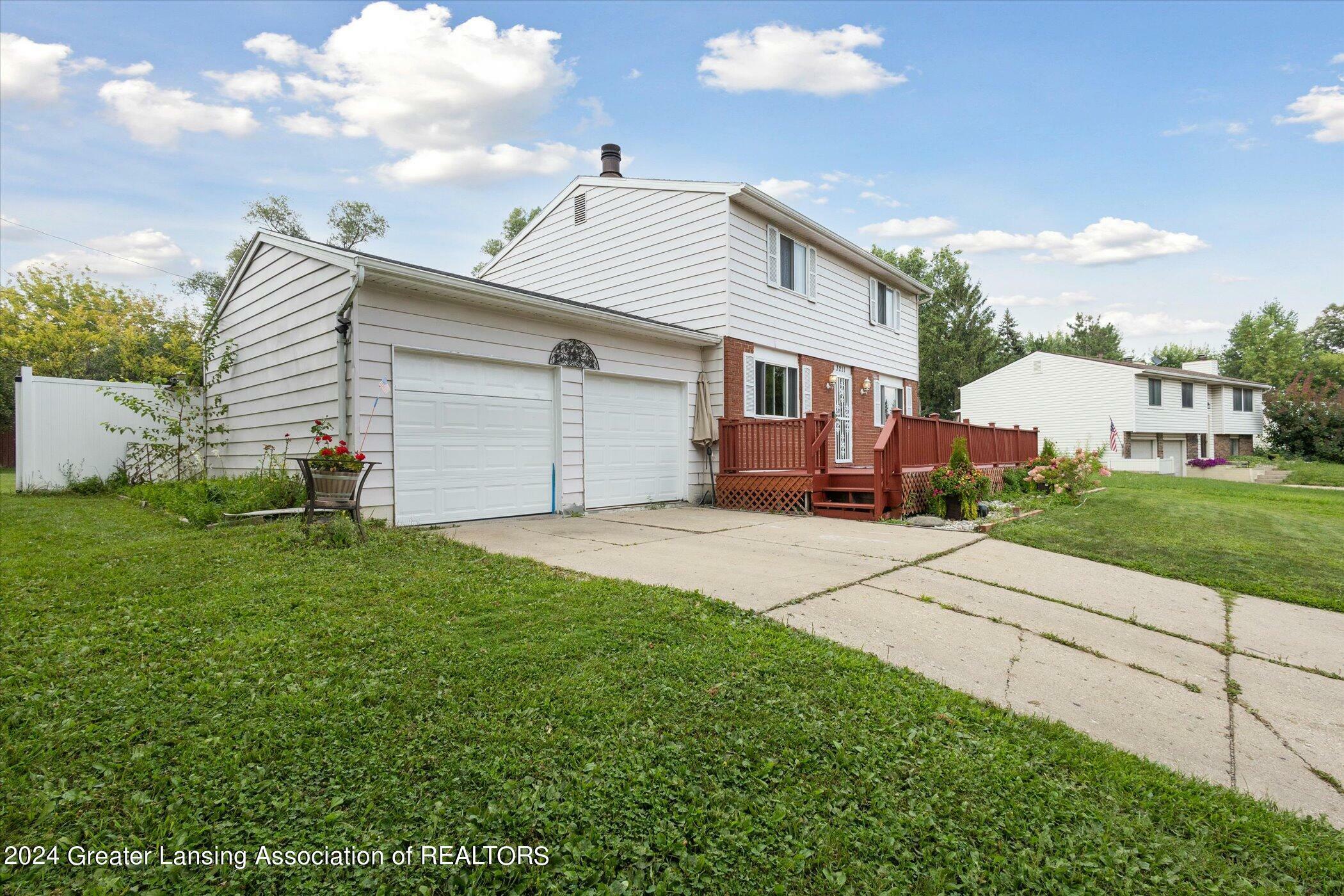 Property Photo:  3211 Stonewood Drive  MI 48912 