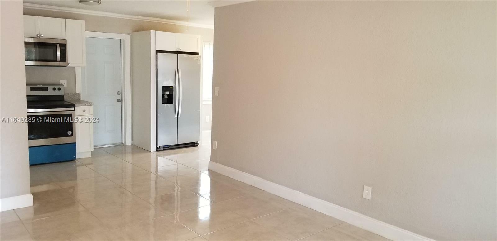 Property Photo:  1440 NE 153rd Ter 1440  FL 33162 