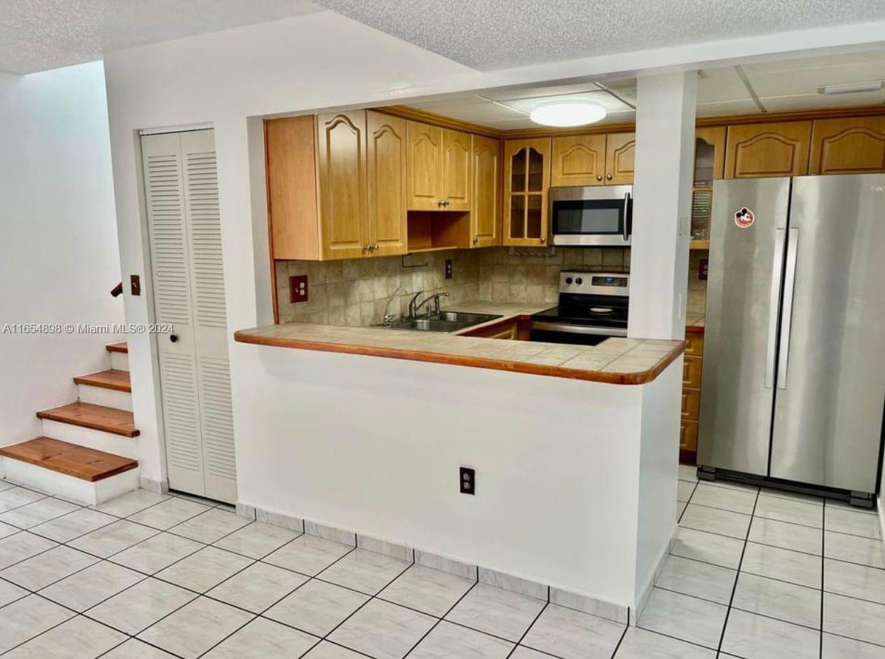 Property Photo:  12035 SW 19th Ter 47  FL 33175 