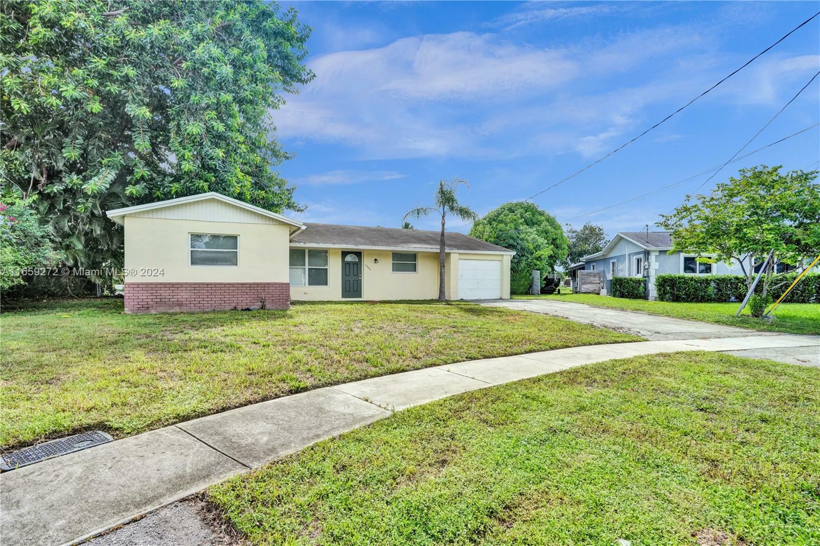 Property Photo:  6860 NW 7th Ct  FL 33063 