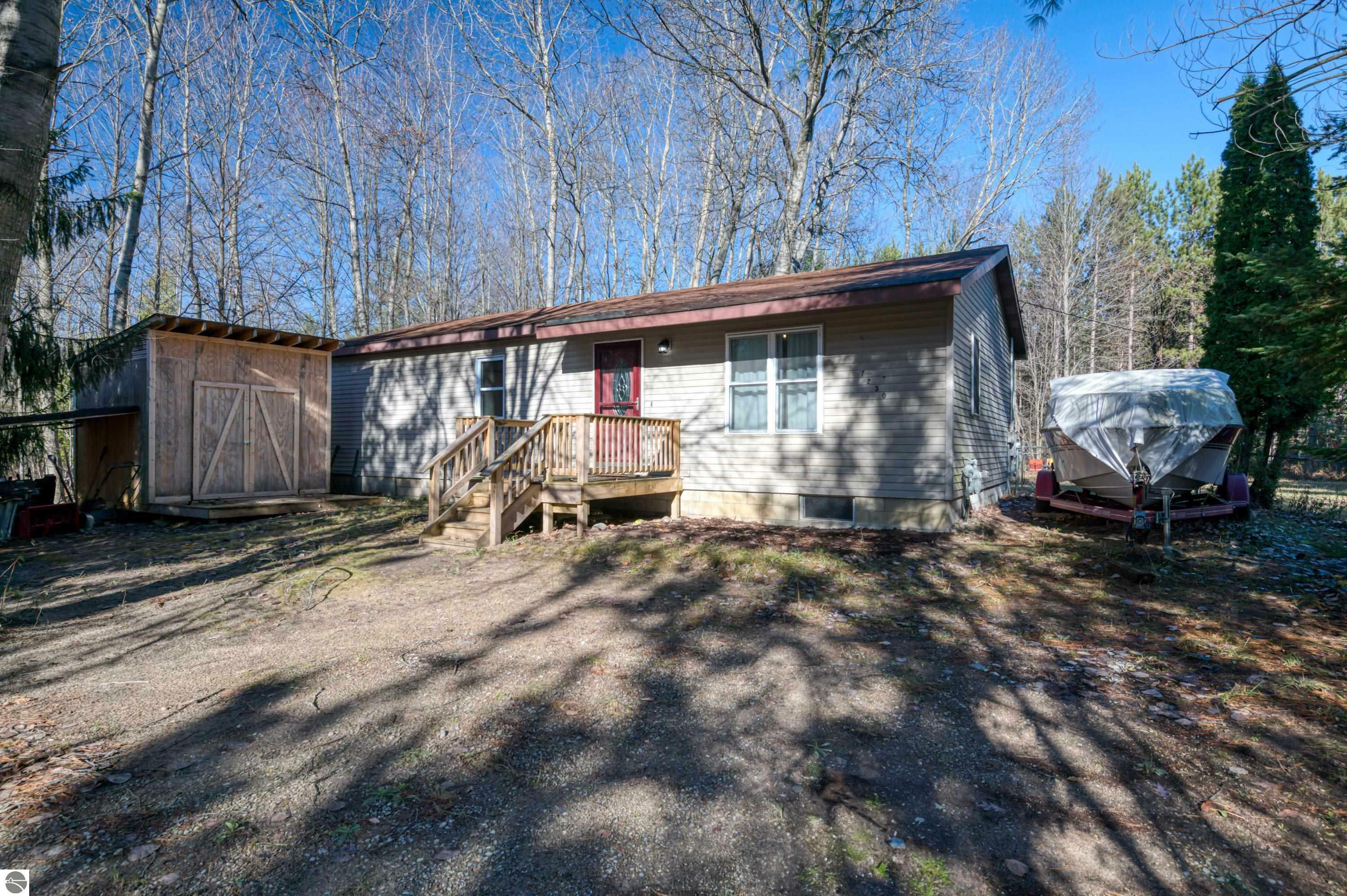 Property Photo:  7250 Sullivan Road  MI 49637 