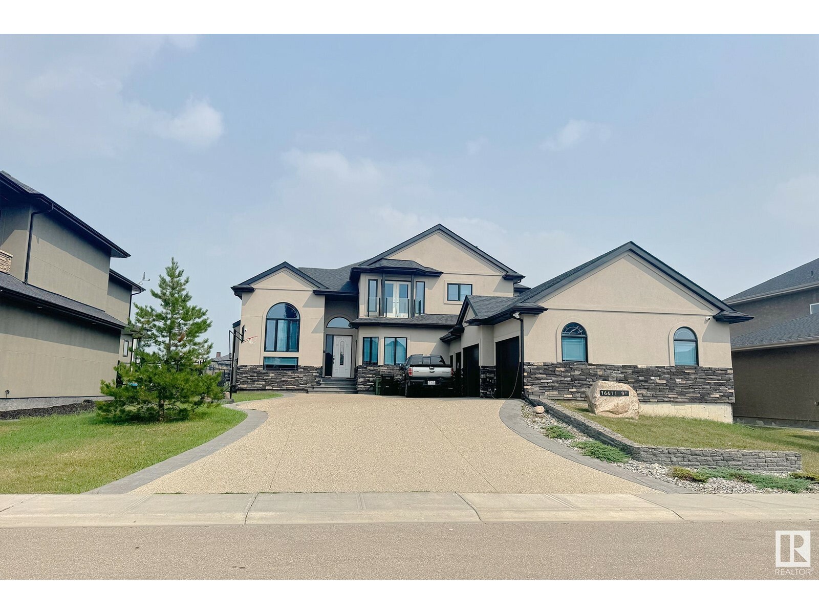 Property Photo: 16611 9 St NE AB T5Y 0P6