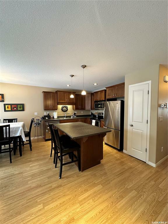 Property Photo:  547 East Hampton Boulevard  SK S7R 0H8 