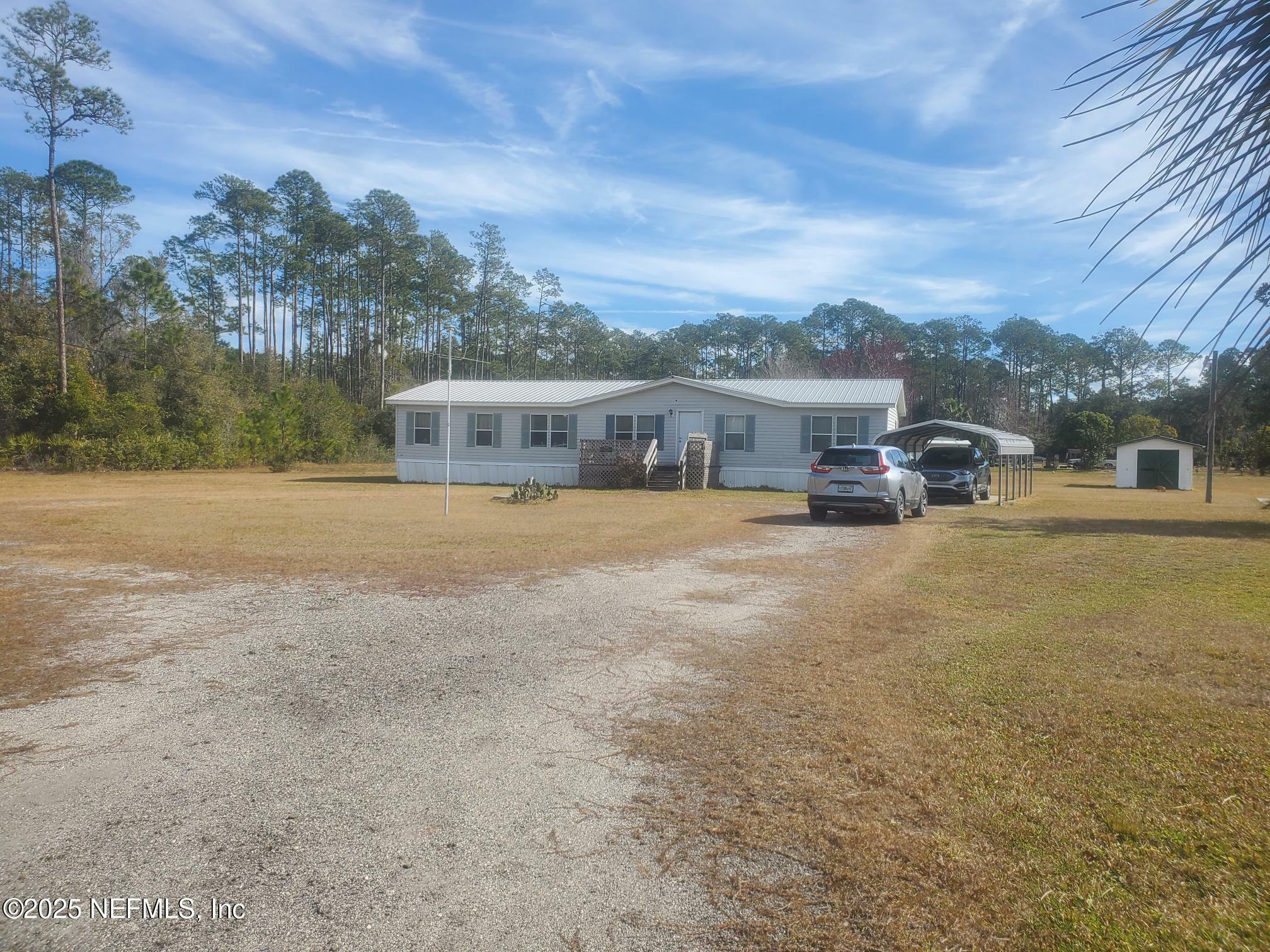 Property Photo:  100 Plantation Pines Drive  FL 32139 