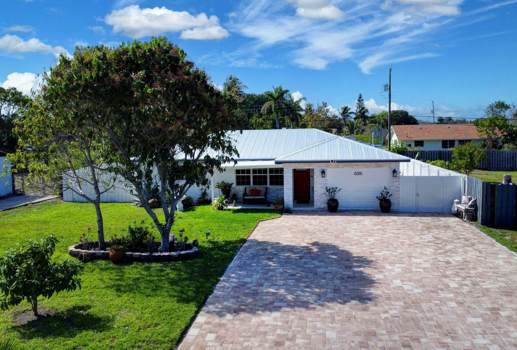 Property Photo:  6585 Osborne Drive  FL 33462 