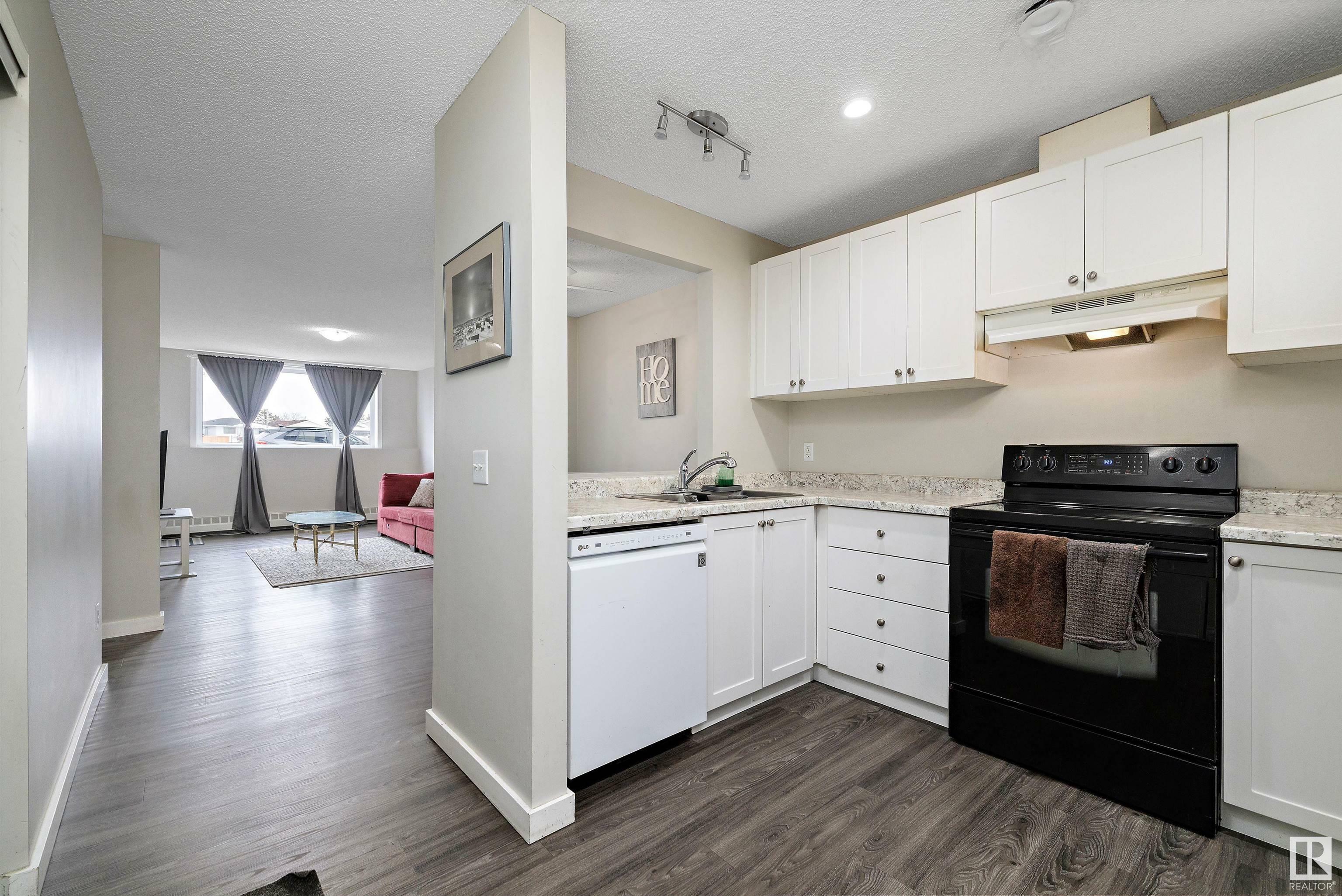 Property Photo: 14808 26 Street NW 101 AB T5Y 2G4