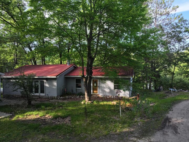 Property Photo:  8750 White Pine Pass SE  MI 49633 