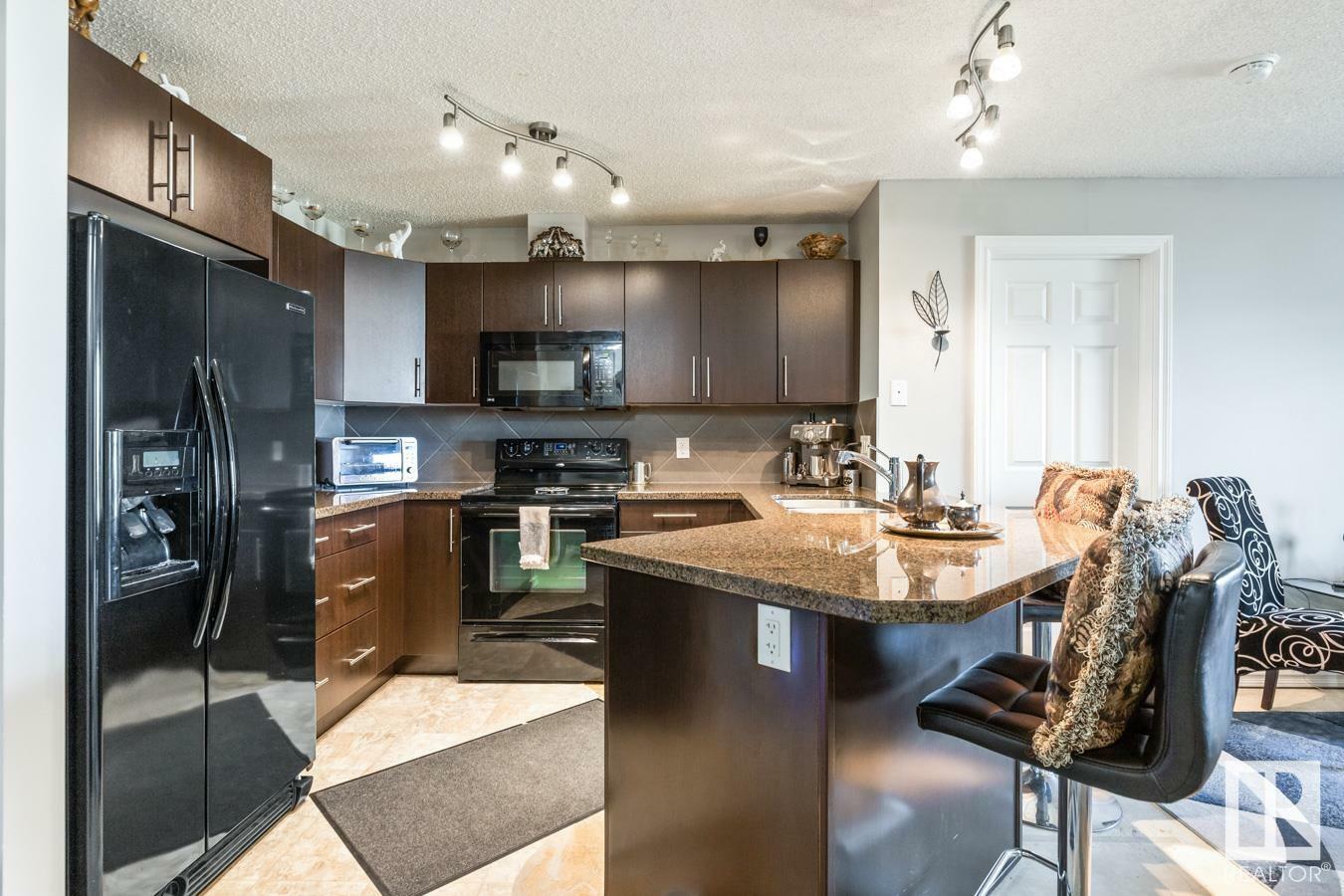 Property Photo: 2208 44 Avenue NW 115 AB T6T 0G6