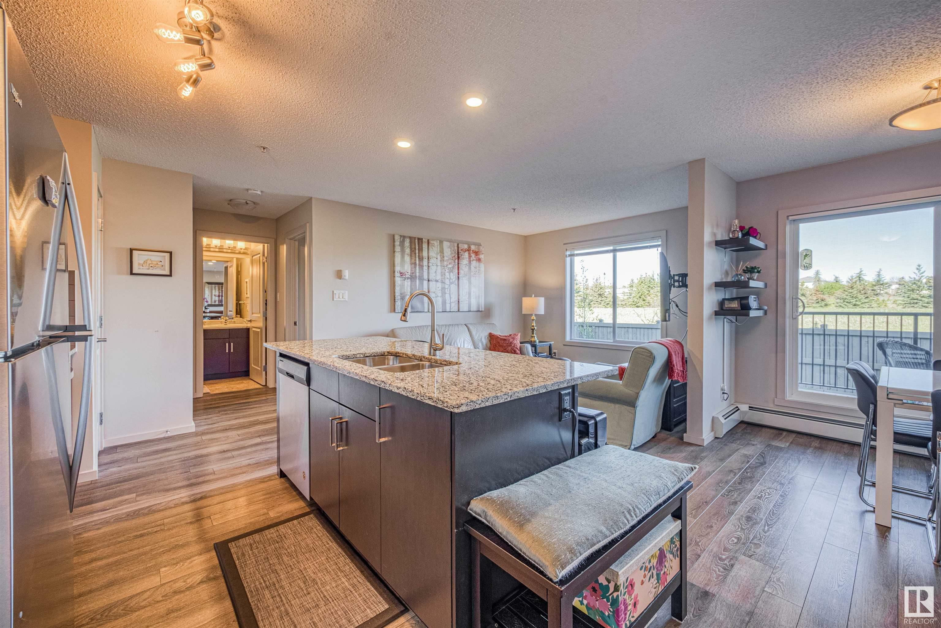 Property Photo: 142 Ebbers Boulevard NW 211 AB T5Y 3W2