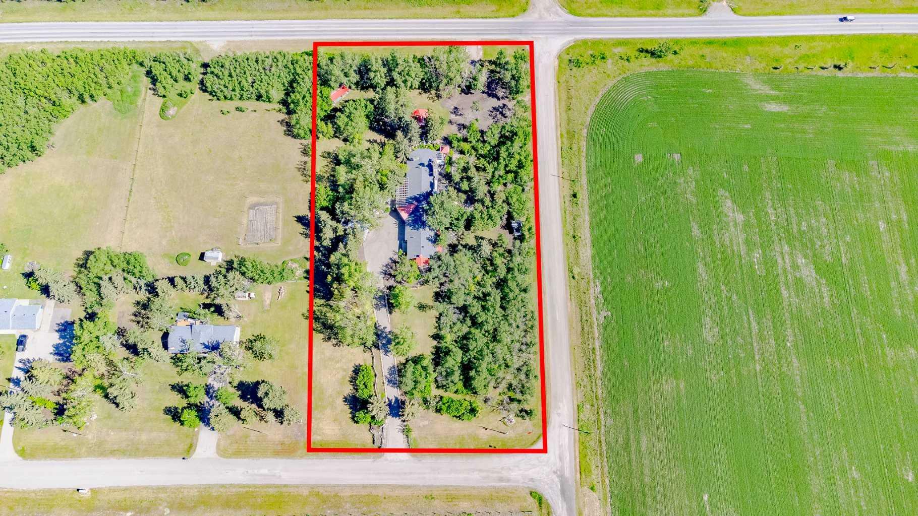 Property Photo: 48010 244 Avenue W AB T1S 4C5