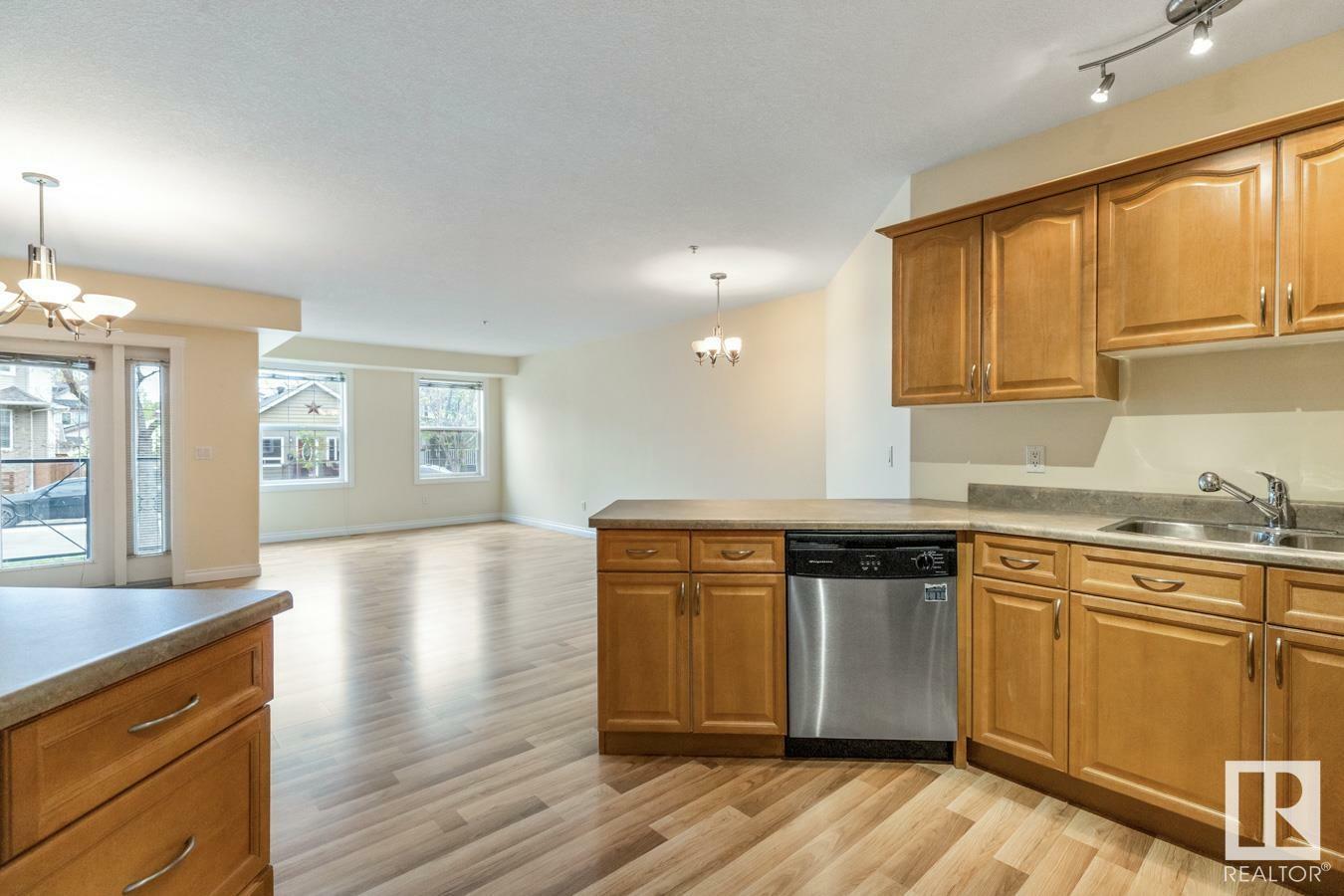 Property Photo: 9739 92 Street NW 102 AB T6C 3S3