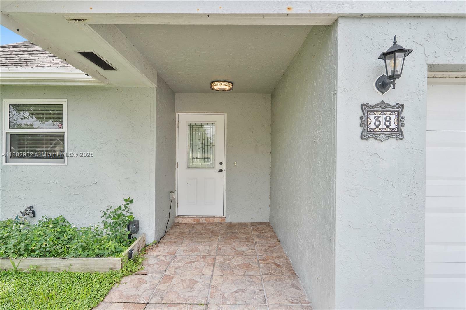 Property Photo: 38 E Tara Lakes Dr E FL 33436