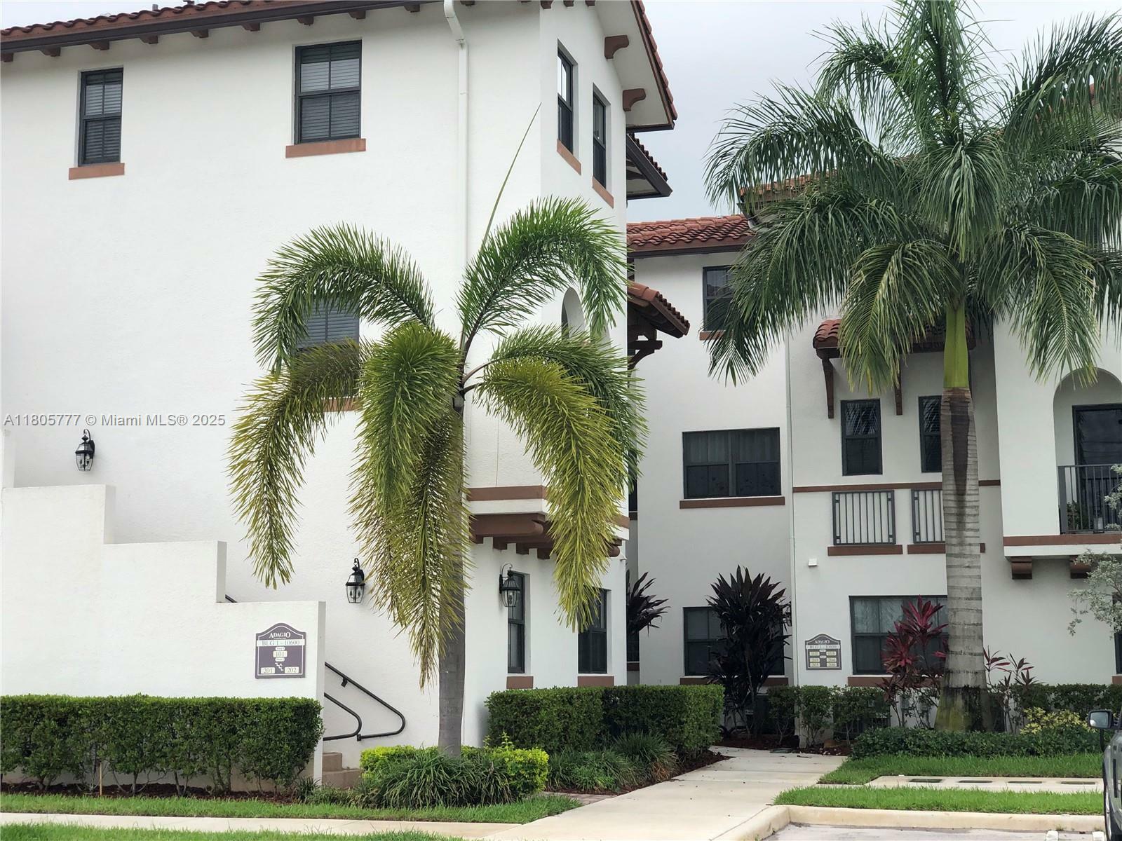 Property Photo: 10600 NW 88th St 1-203 FL 33178