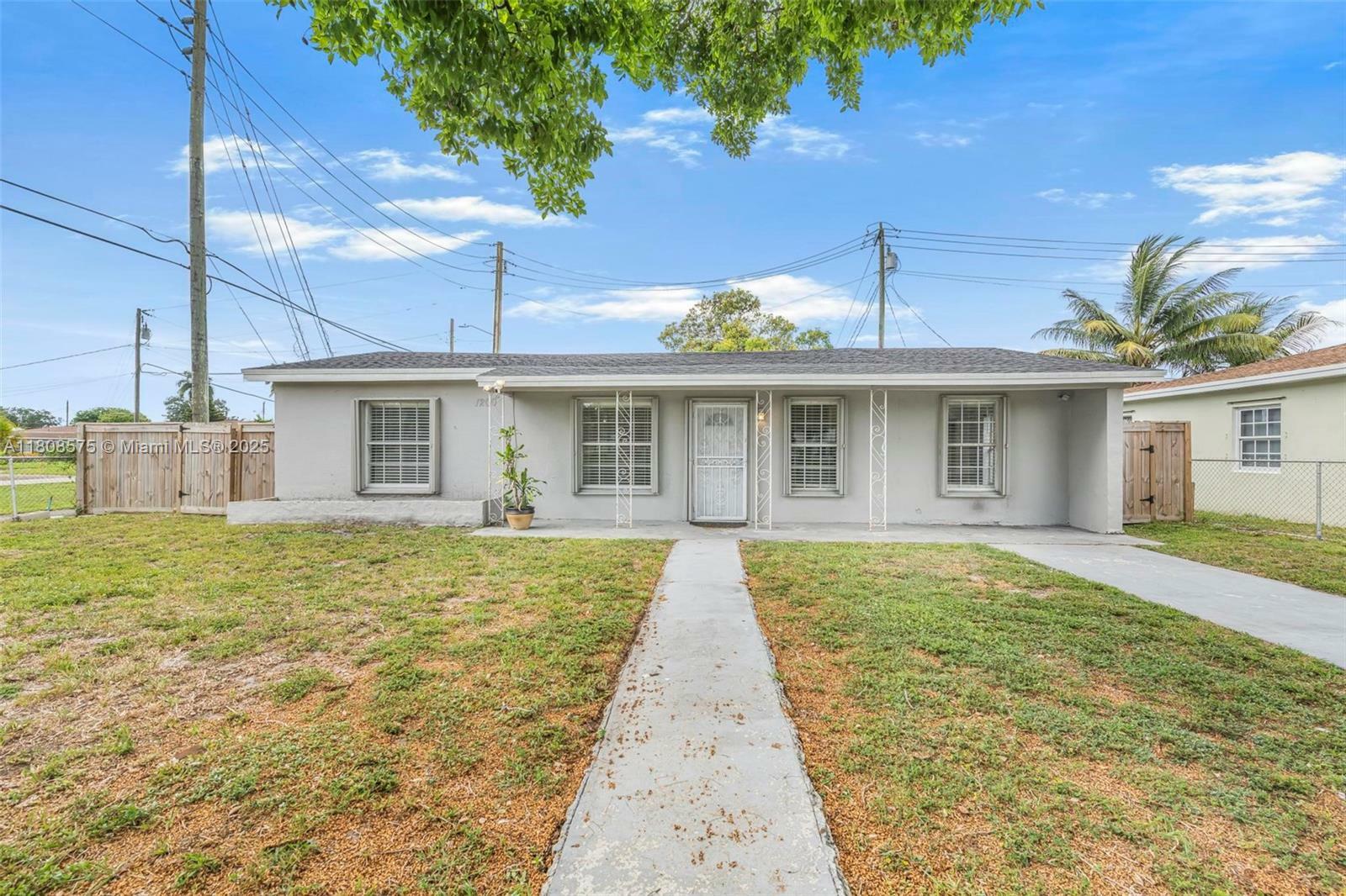 Property Photo: 1200 NW 87th St FL 33147