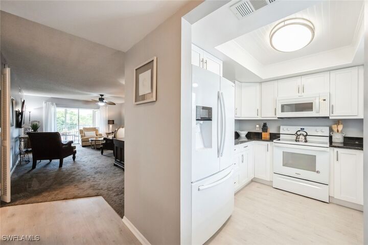 Property Photo:  5651 Rattlesnake Hammock Road C-201  FL 34113 