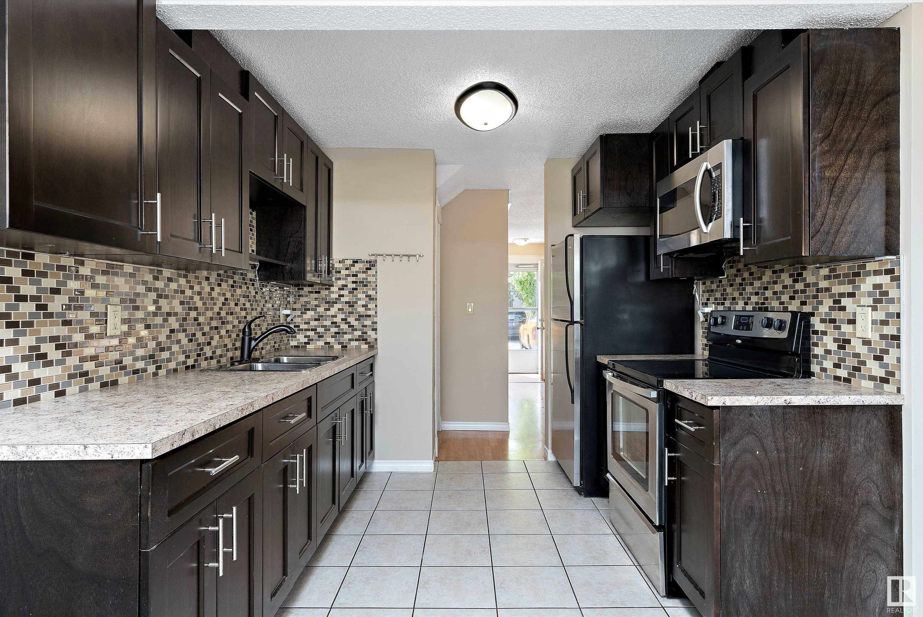 Property Photo: 14795 25 Street NW AB T5Y 2E8