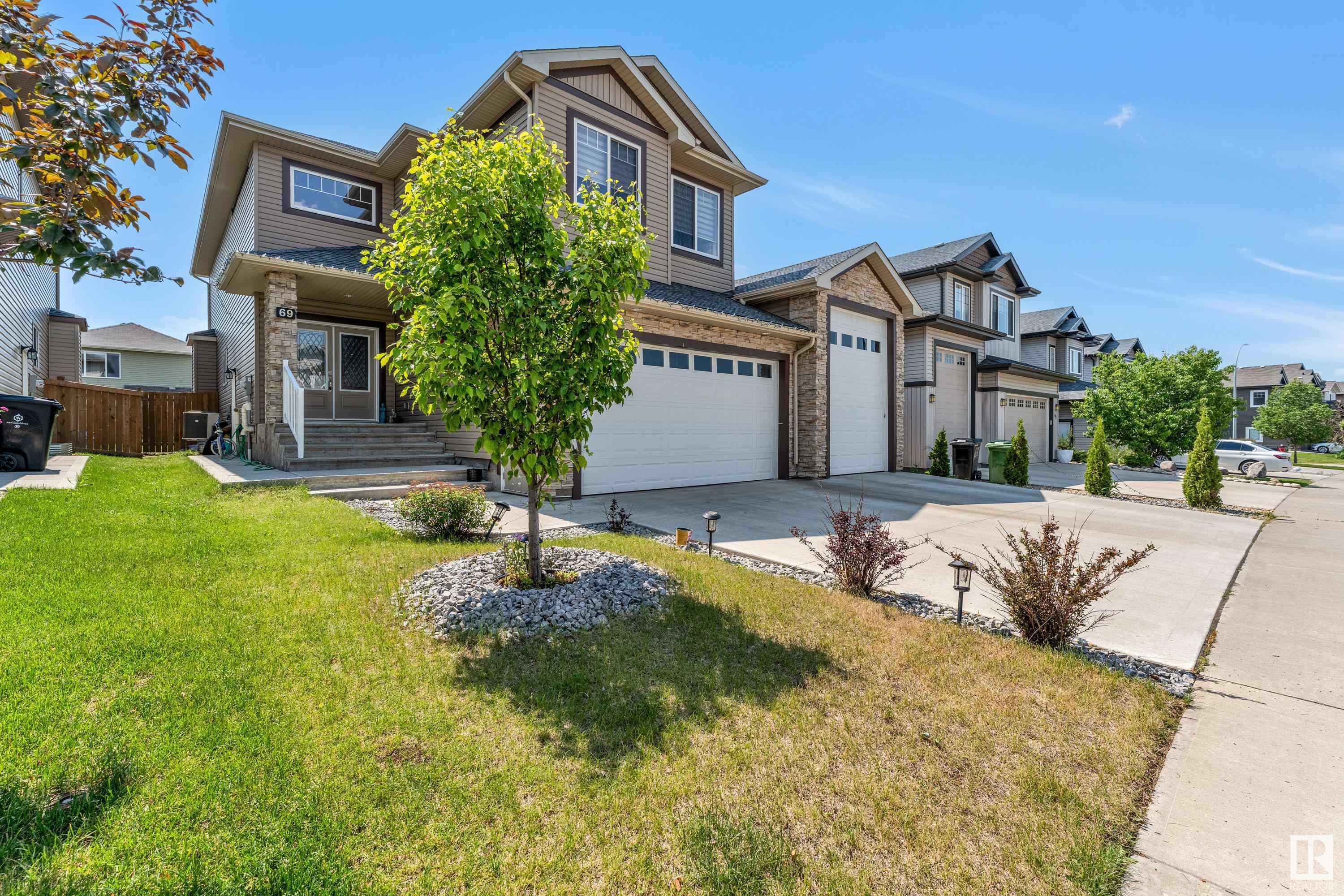 Property Photo: 69 Caragana Way AB T8L 0H4