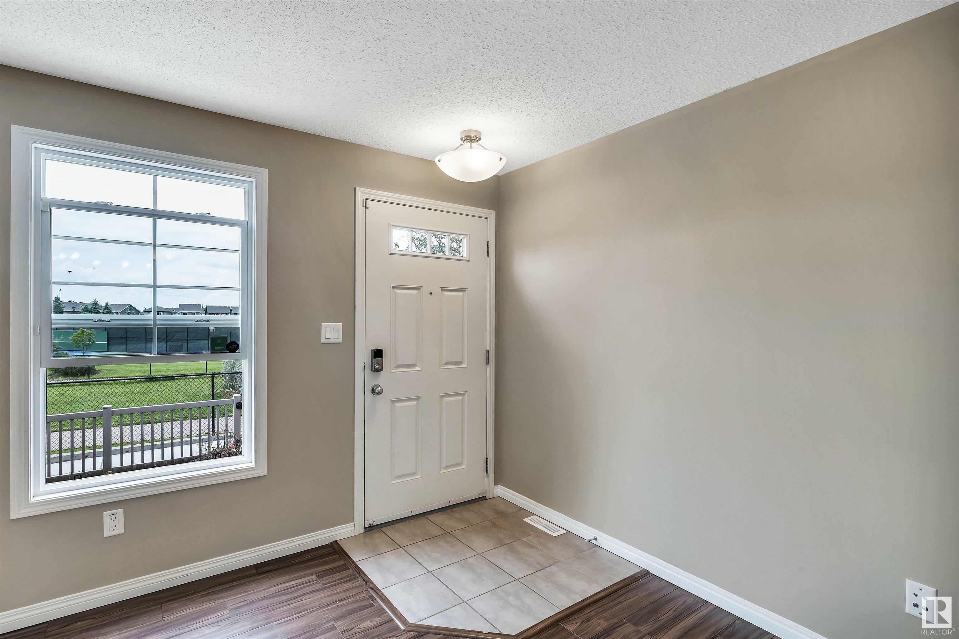Property Photo: 4029 Orchards Drive SW 60 AB T6X 1V2