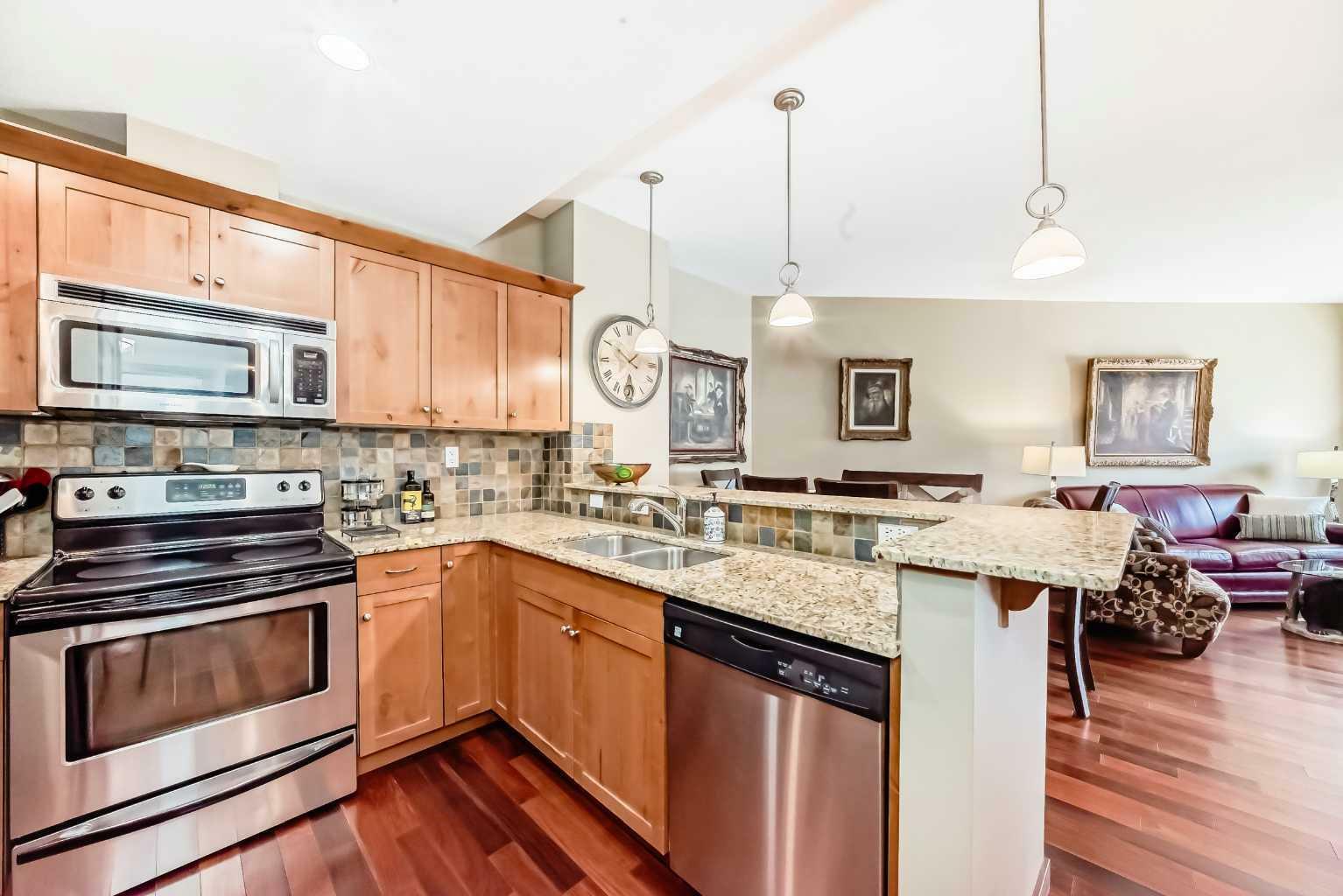 Property Photo:  1002 8 Avenue 311  AB T1W 0C4 