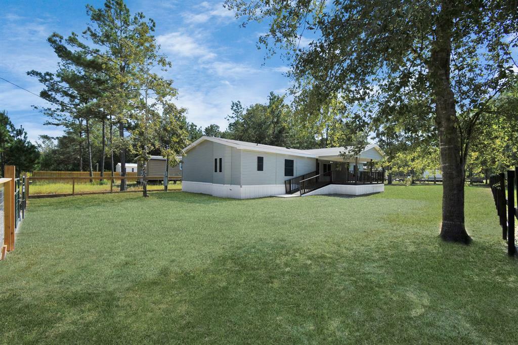 Property Photo: 422 County Road 3414 TX 77327
