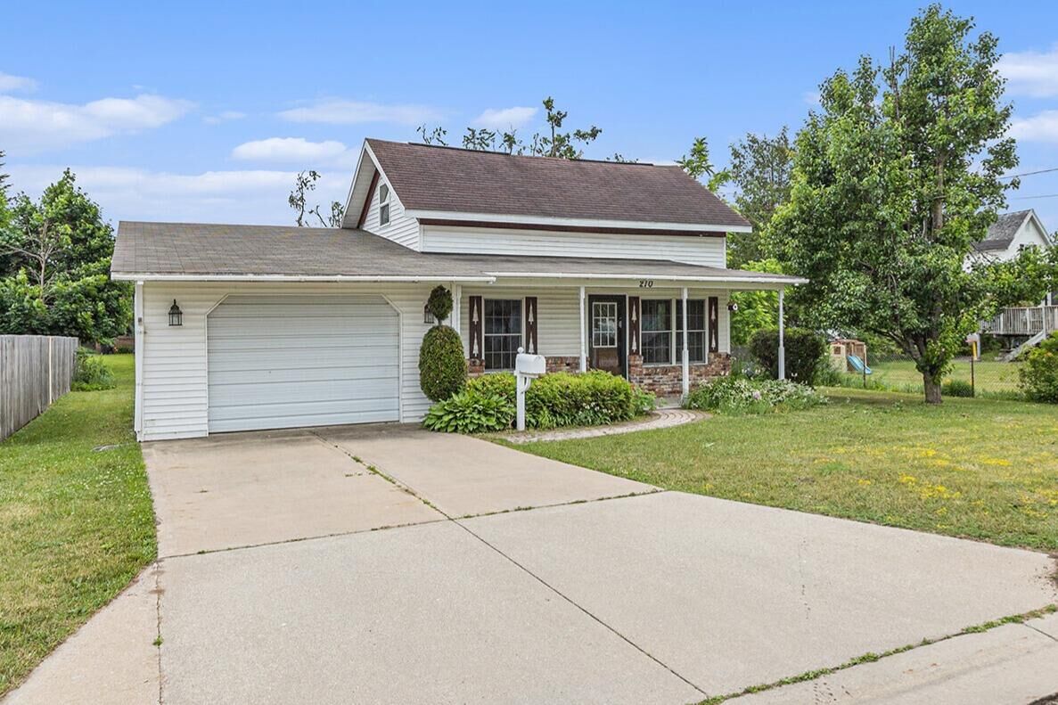 Property Photo:  210 Huron Street  MI 49735 