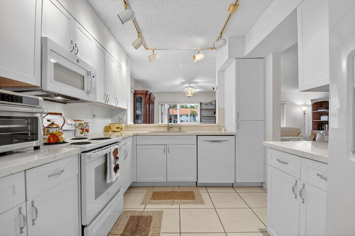 Property Photo:  7390 Lake Meadow Way 101  FL 33437