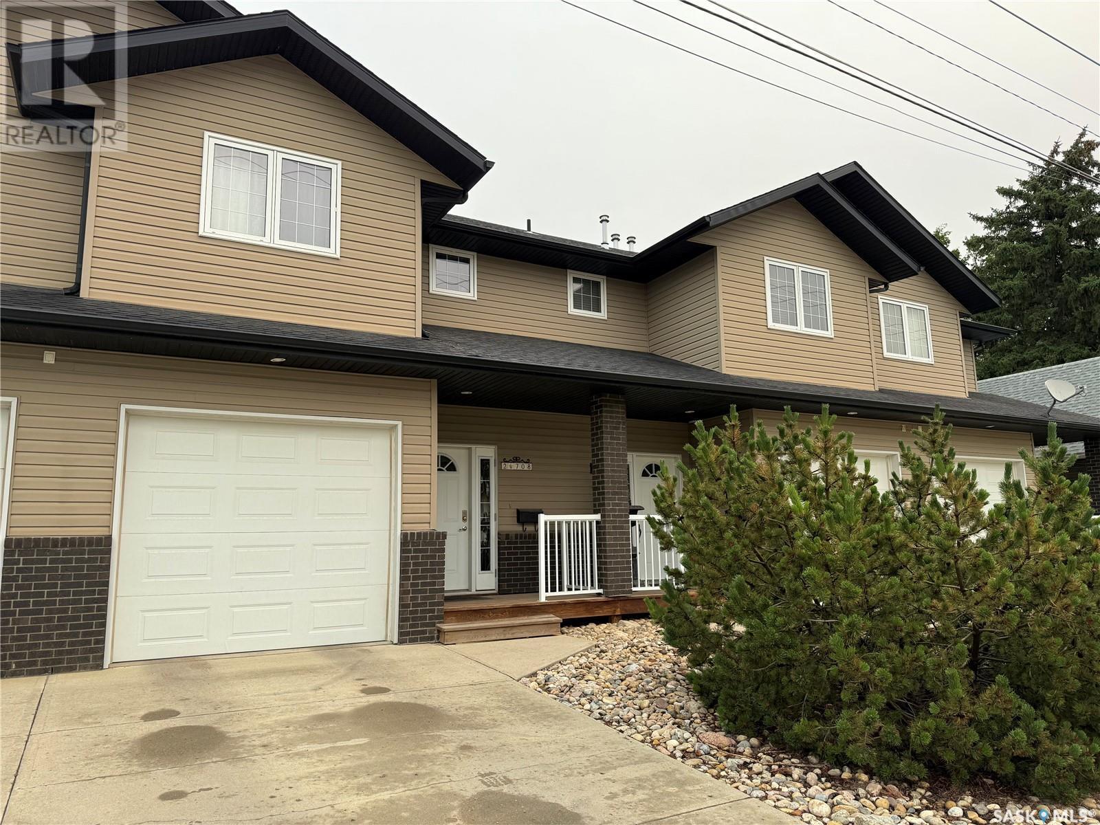 Property Photo:  #2 708 Macdonald Street W  SK S6H 2W2 
