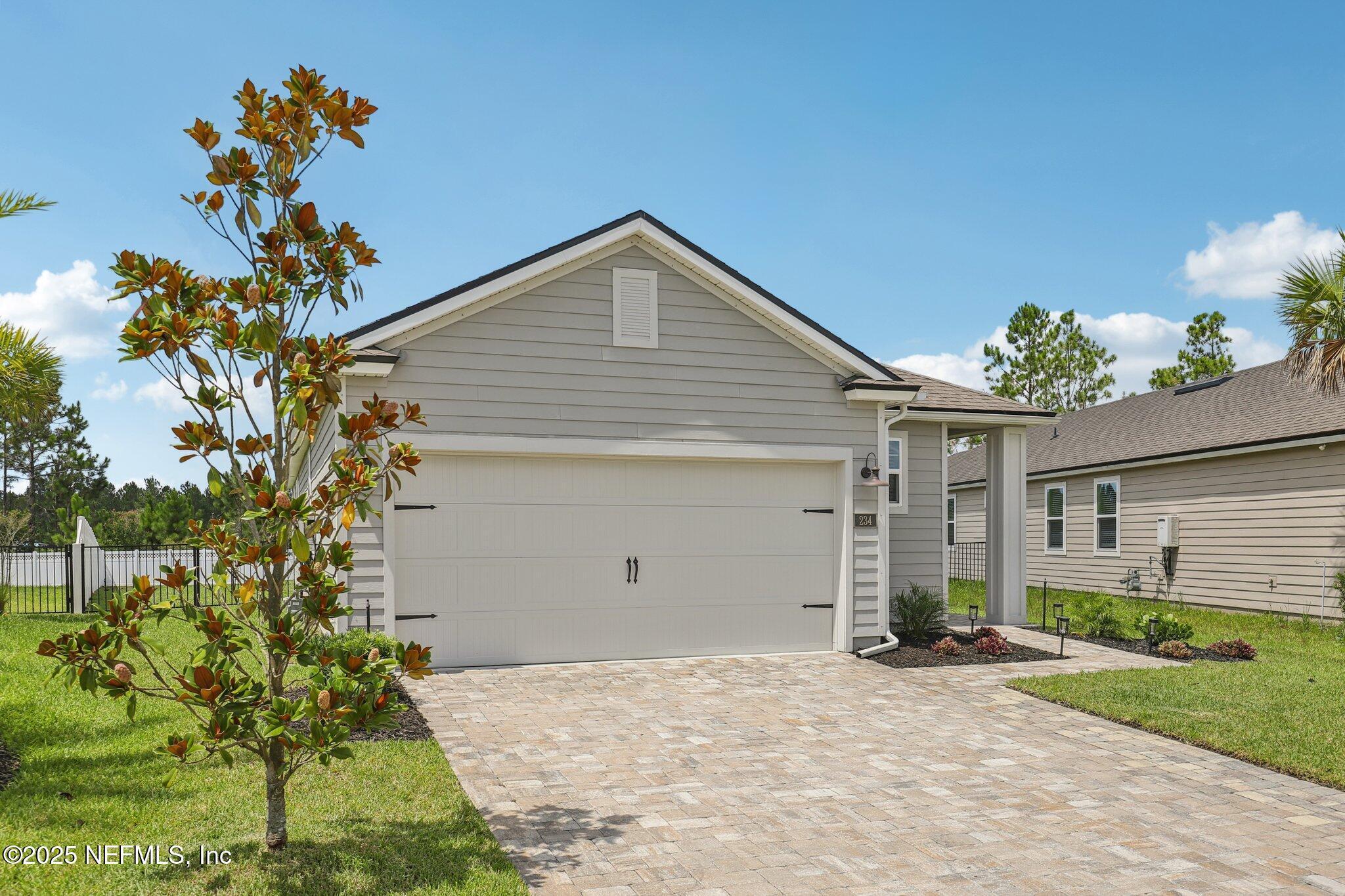 Property Photo: 234 Thistleton Way FL 32092