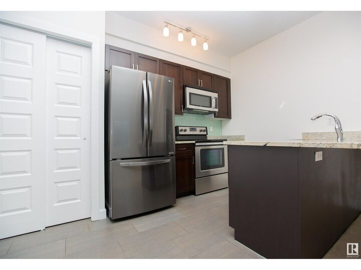Property Photo:  #304 1238 Windermere Wy SW  AB T6W 2J3 