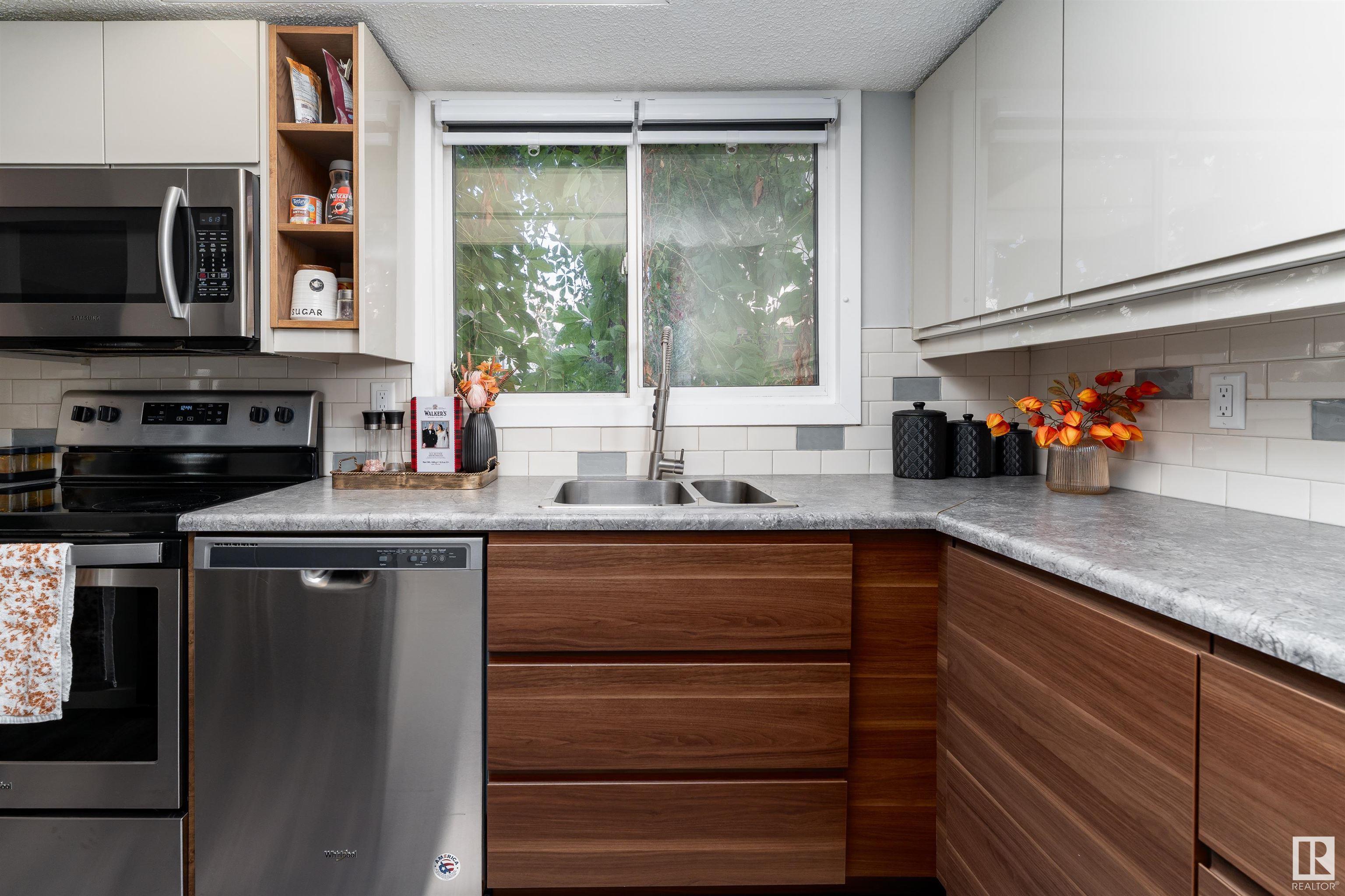 Property Photo:  13841 24 Street NW  AB T5Y 1K1 