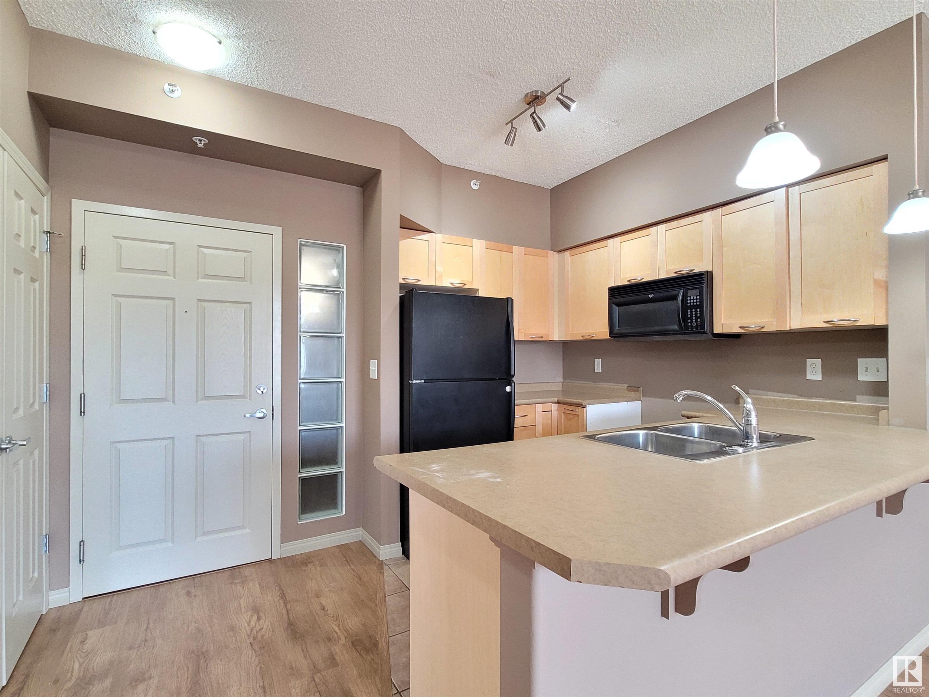 Property Photo:  4245 139 Avenue NW 2-616  AB T5Y 3E8 