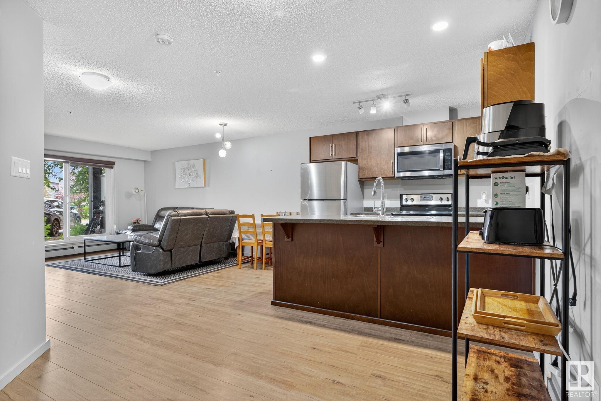 Property Photo:  5404 7 Avenue SW 110  AB T6K 2K4 