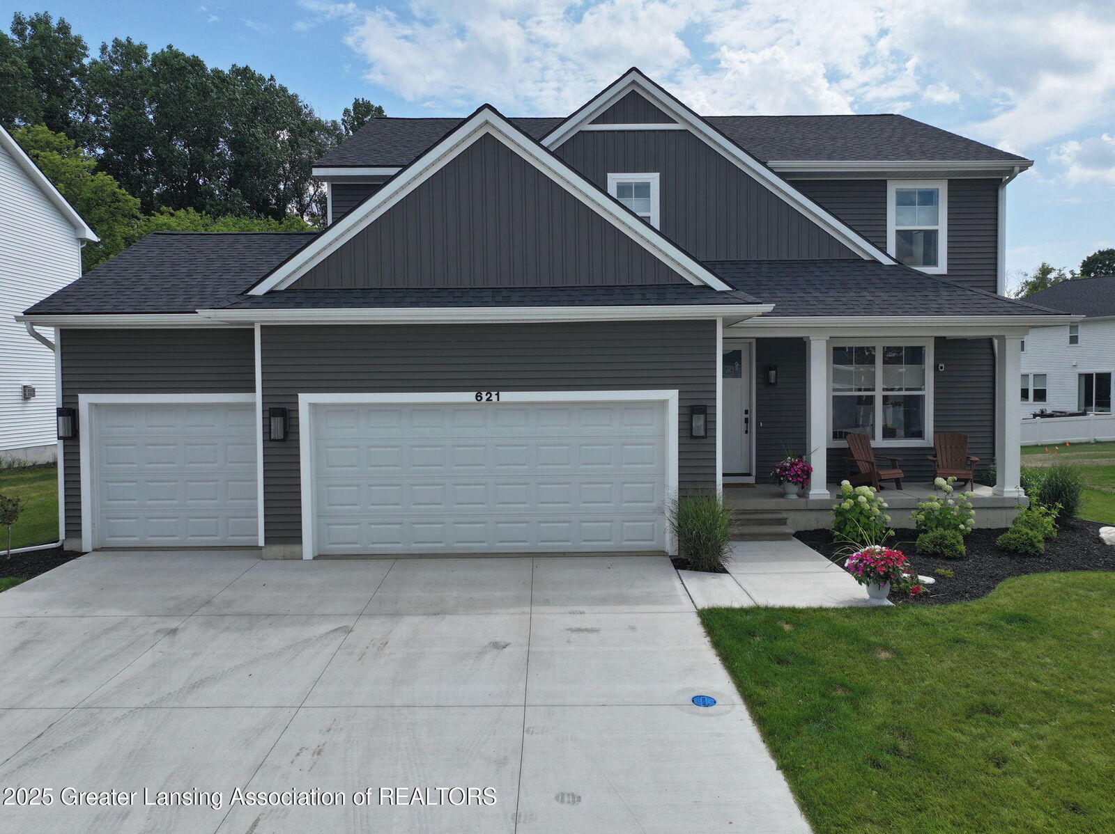 Property Photo:  621 Titanium Trail  MI 48840 