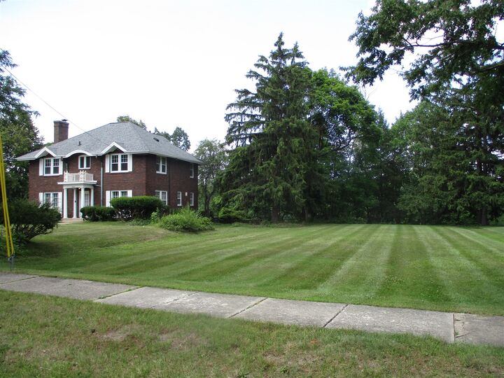 Property Photo:  1912 Moores River Drive  MI 48910 